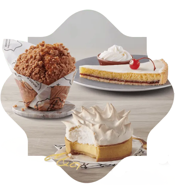 A variety of Mugg & Bean cakes on white platters