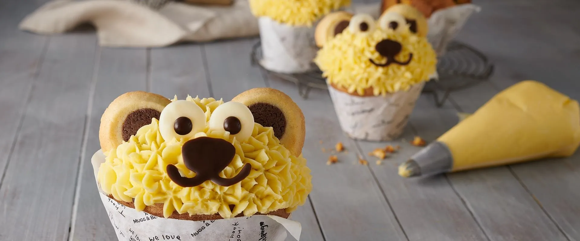 Giant muffins with yellow icing