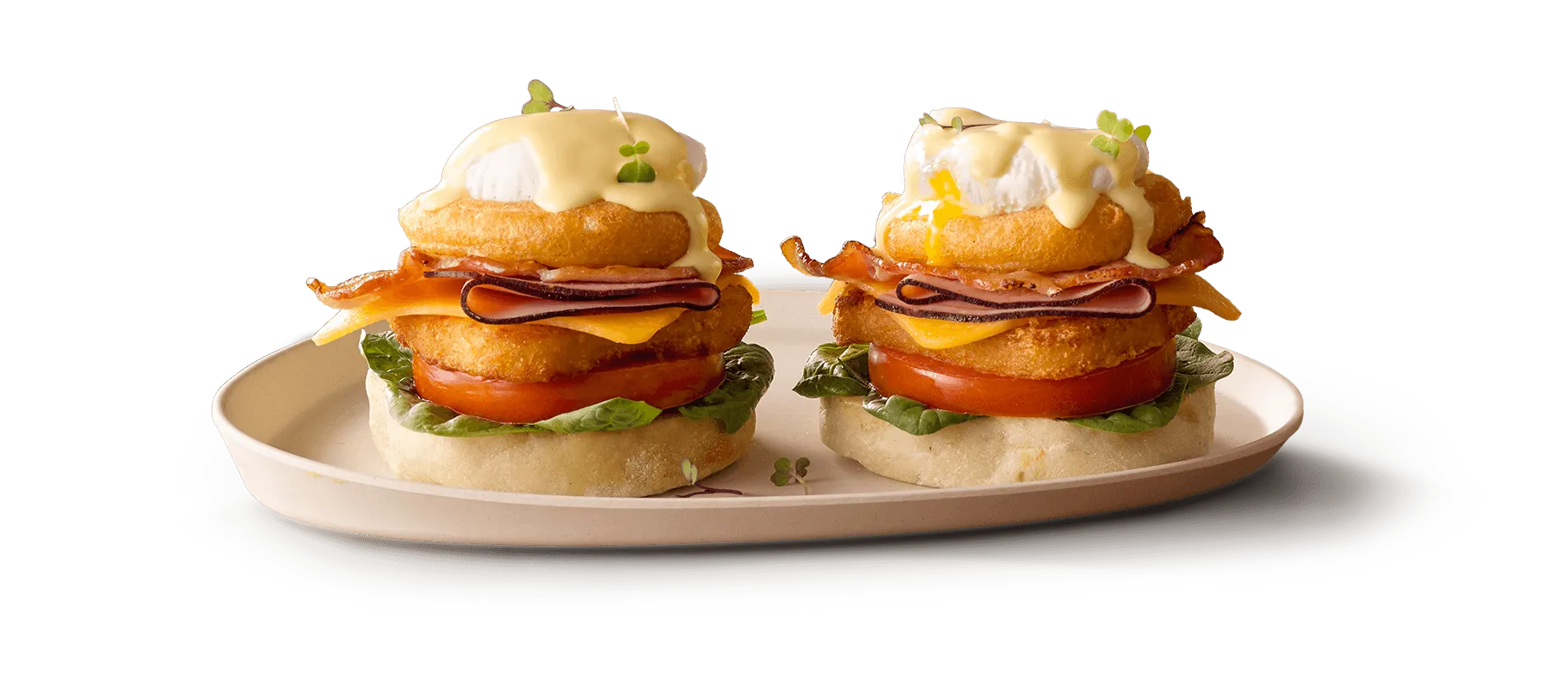 Eggs Benedict with poached eggs, hollandaise sauce, and fresh greens Eggs Benedict with poached eggs, hollandaise sauce, and fresh greens