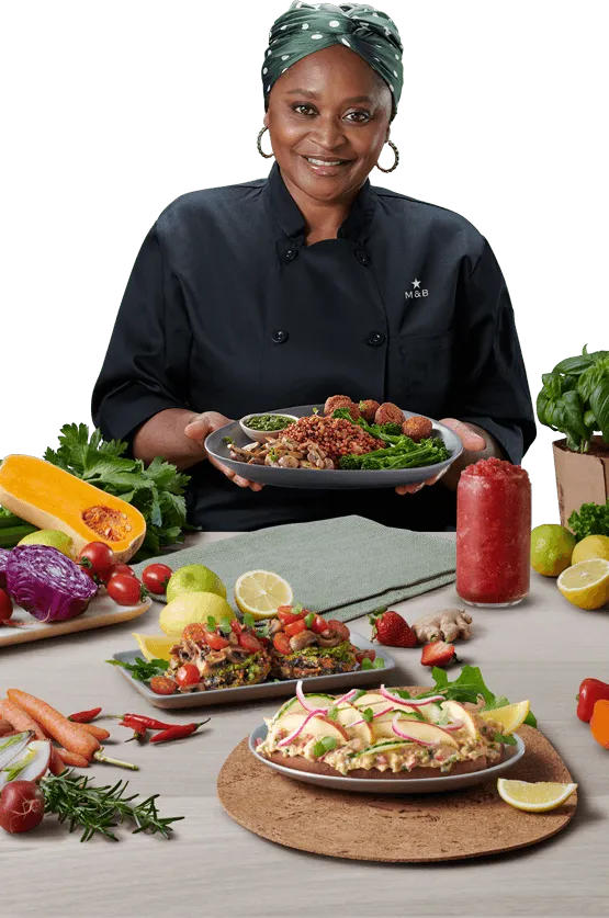 Chef Mokgadi holding a plate of food