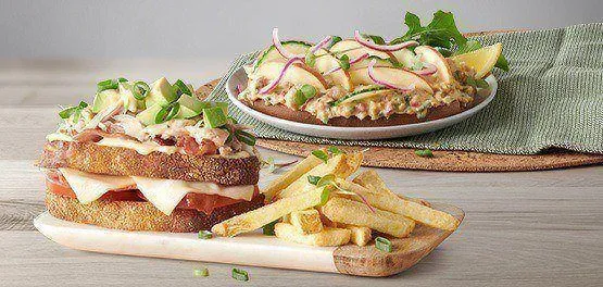Delicious sandwich, fresh salad, and fries