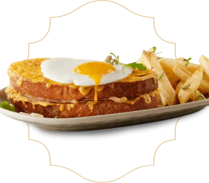 Eggs Benedict with Chips on a serving plate Eggs Benedict with Chips on a serving plate