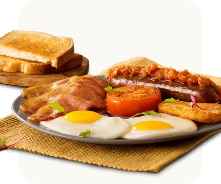 Heritage Day breakfast, bacon and eggs with boerewors and hashbrown on a serving plate