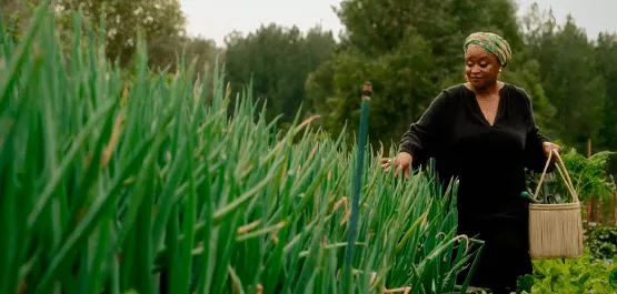 Chef Mokgadi standing in and admiring her garden