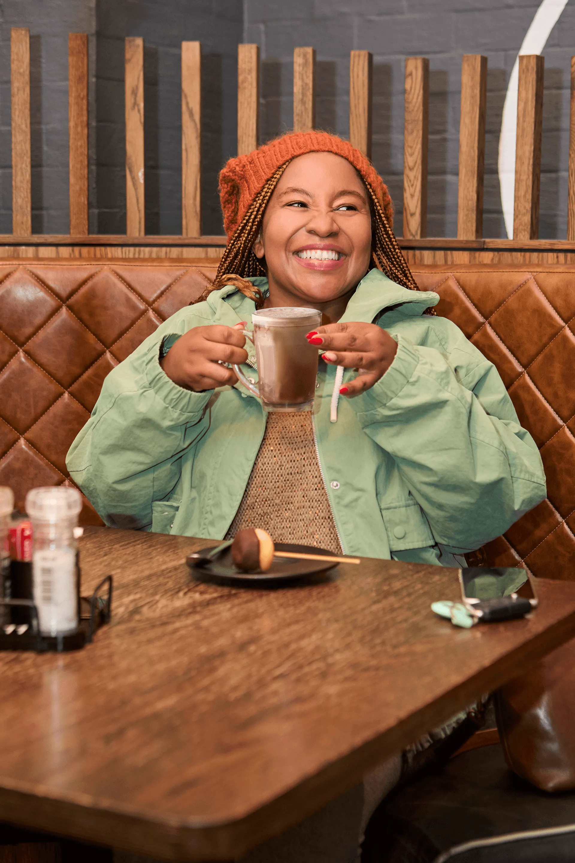 A Lady in Mugg and bean enjoy a warm drink and dessert side A Lady in Mugg and Bean enjoying a warm drink and dessert side