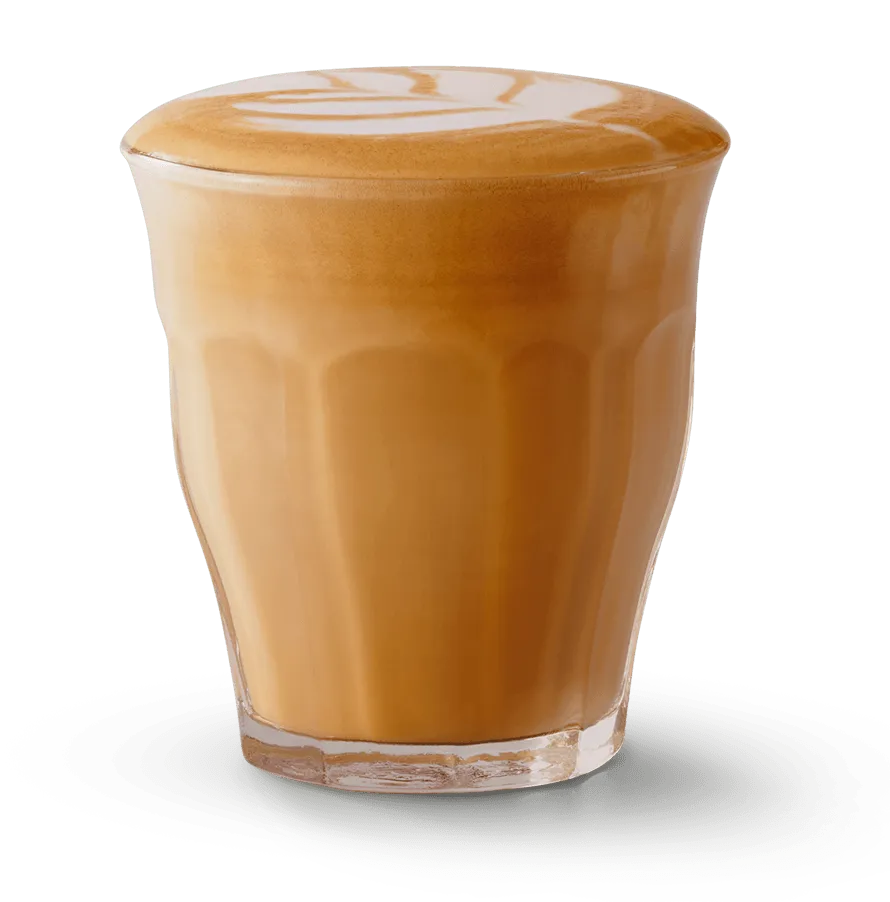 A shot of Cortado in a clear glass A shot of Cortado in a clear glass