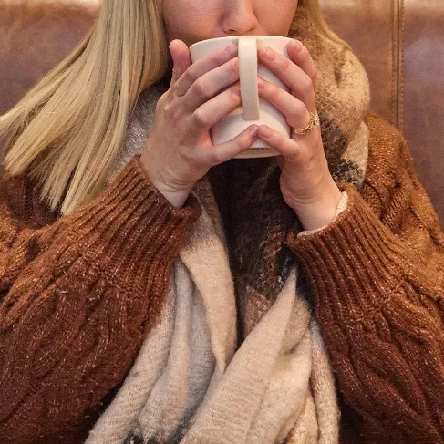Hot takeout coffee served in a Mugg & Bean cup, ideal for warming up on cold