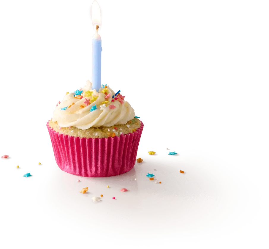 Cupcake with a candle lit Cupcake with a candle lit