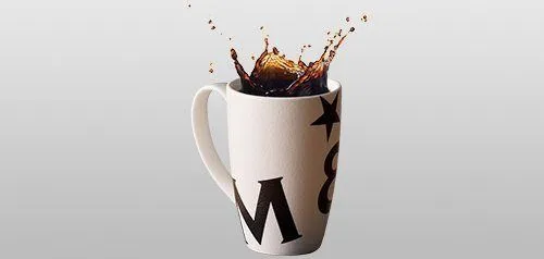 Coffee splashing in a mug