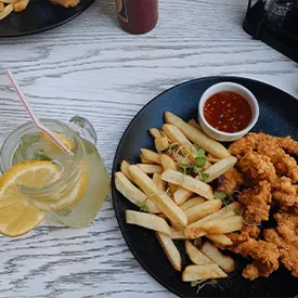 Chicken strips and chips with lemonade