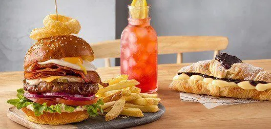 Burger breakfast and croissant with lemonade