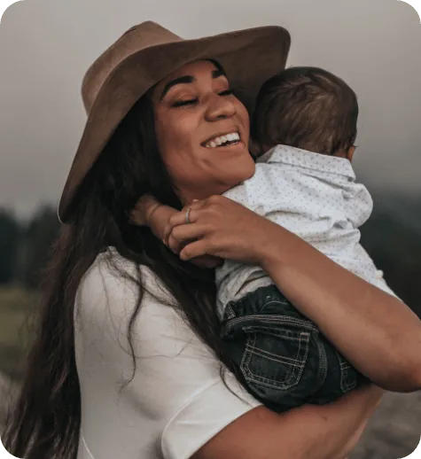Woman hugging a baby