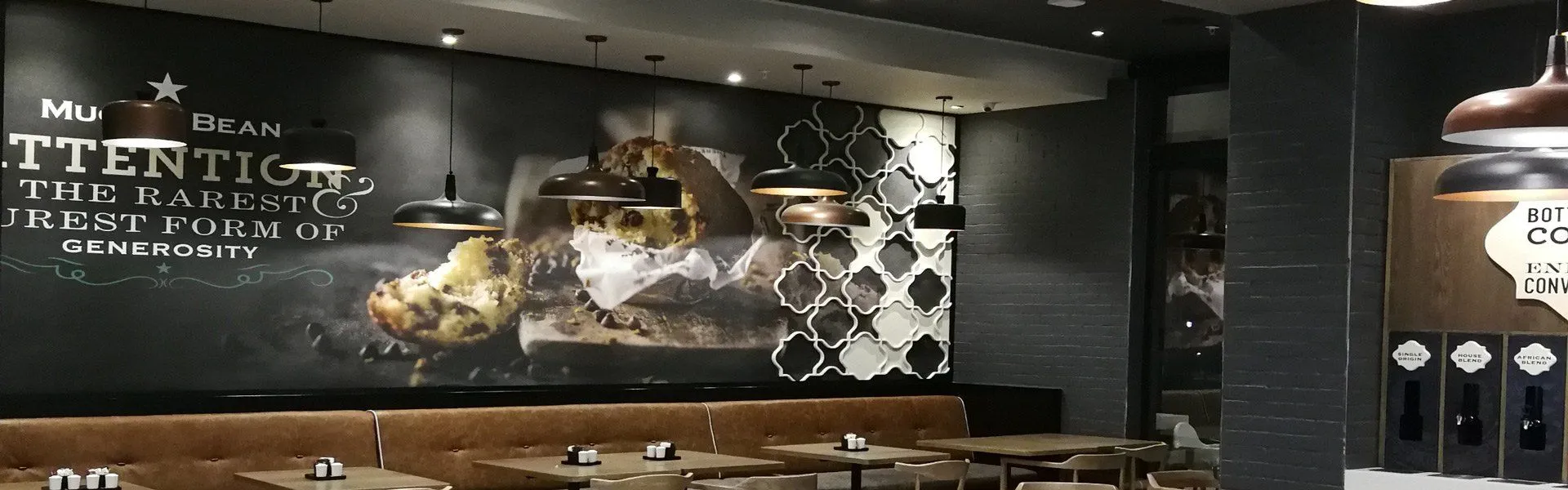 restaurant view in store with tables and decorated wall