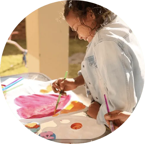 Nikita painting a heart