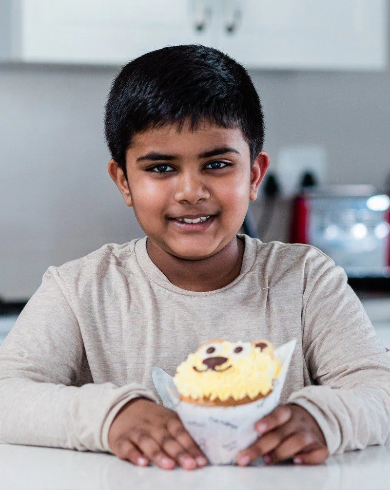 Armaan with a cupcake
