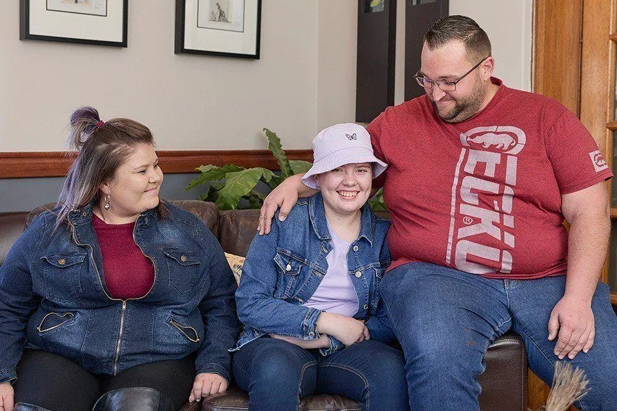 Family sitting on a couch