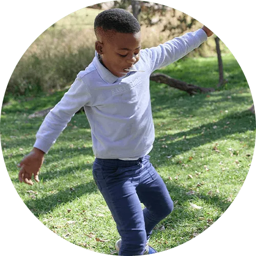Mhlengi playing with a soccer ball