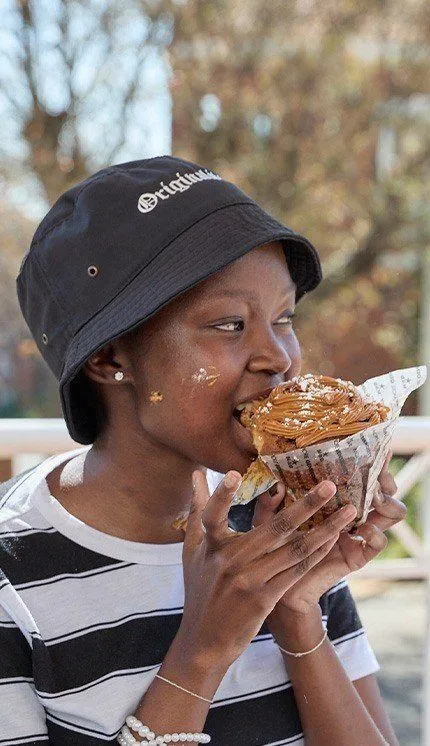 Mpho eating a cupcake