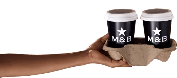 Hand holding two takeaway coffees in holder
