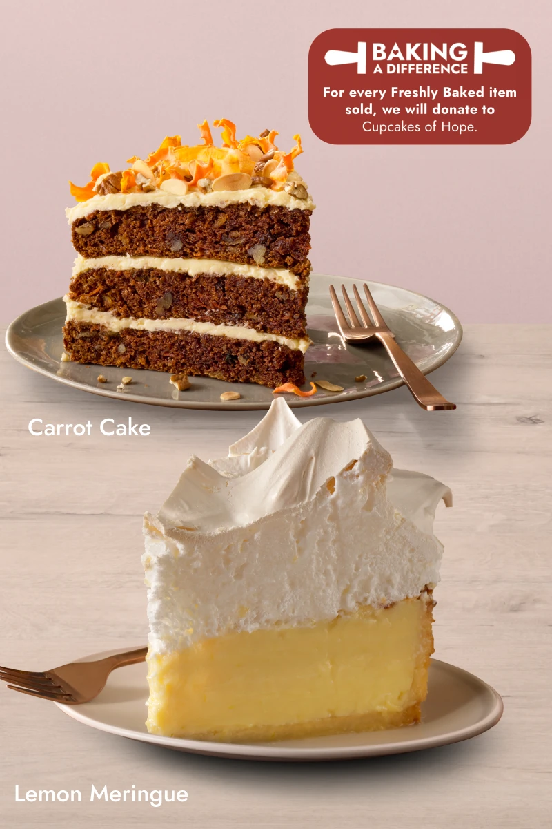 Two dessert slices on plates: a tall Lemon Meringue Slice with a fluffy meringue topping and creamy lemon filling, and a layered Carrot Cake Slice with cream cheese frosting and topped with nuts and carrot shavings.