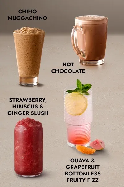 A variety of colorful iced drinks in mason jars with straws 