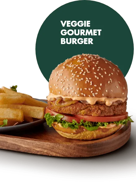 A veggie gourmet burger with fresh lettuce, tomato, pickles, and a soft bun