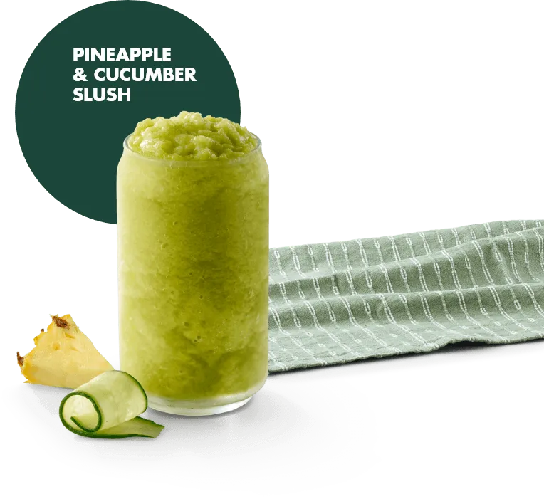 Pineapple and cucumber slush in a serving glass on a white background