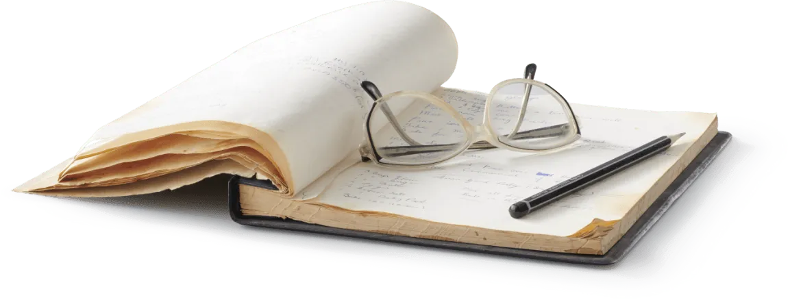 Book with Glasses & a pen on top