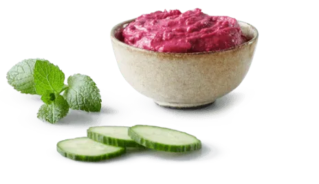 Beetroot hummus and cucumber with a sprig of mint