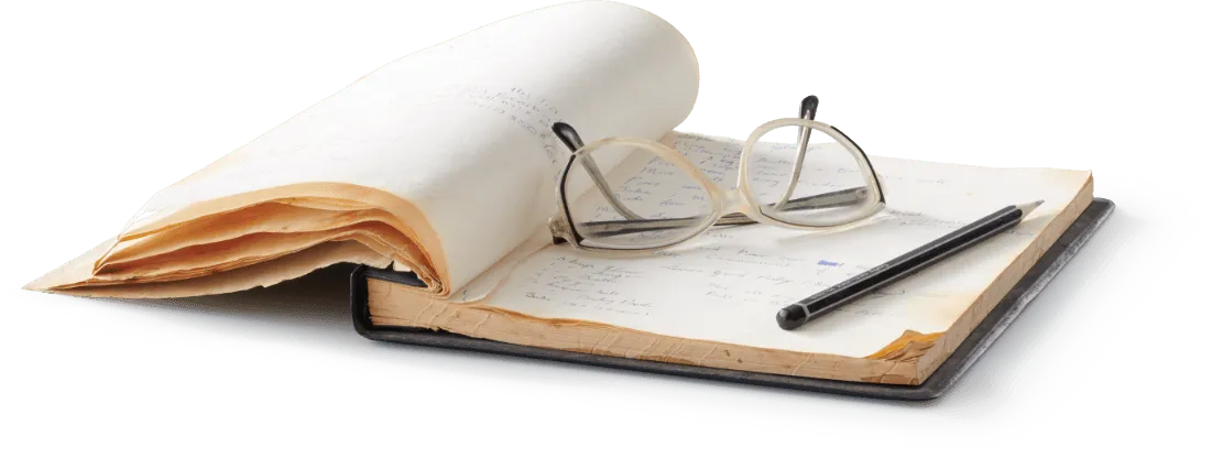 Book with reading glasses and a pen